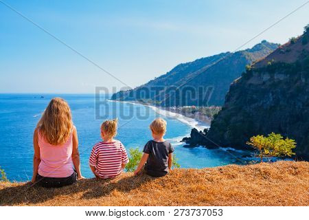 Family Vacation Lifestyle. Happy Mother, Kids On Hill With Scenic View Of High Cliffs, Fishers Villa