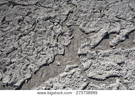 Dry Lake Bed With Natural Texture Of Cracked Clay And Salt On The Ground Cause Of Dehydration For A