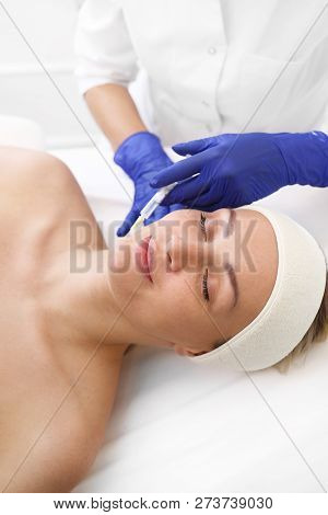 Cleavage Lift. Acidic Skin Injection.
A Patient In A Cosmetic Clinic, A Beautician Performs An Injec