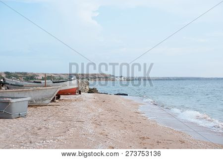 Old Fishing Boats On A Sandy Beach.