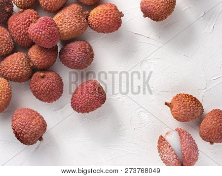 Lichee Fruit On White Textured Background. Lichee Wit Copy Space. Top View Or Flat Lay.