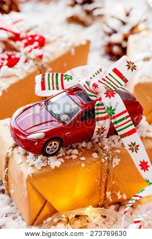 Christmas And New Year Background With Toy Car Present With Ribb