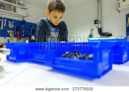 Vilnius, Lithuania - November 23, 2018: Kid Making Lego Robot Mindstorms. Robotic, Learning, Technol