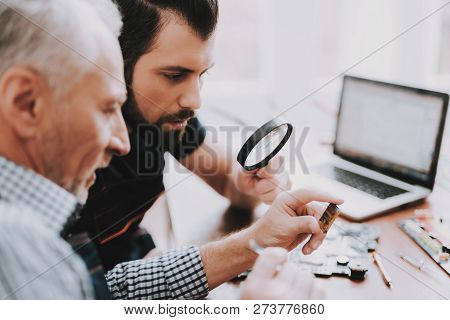 Two Men Repairing Hardware Equipment From Pc. Repair Shop. Worker With Tools. Computer Hardware. You