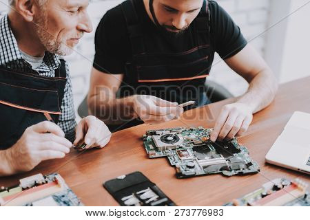 Two Men Repairing Hardware Equipment From Pc. Repair Shop. Worker With Tools. Computer Hardware. You