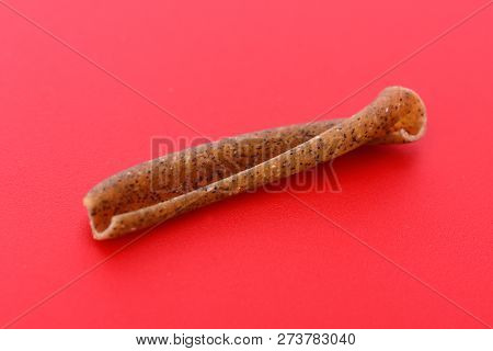A Casarecce Of Legume On Red Background