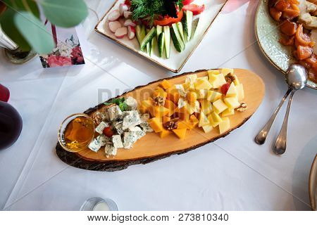 Plate With Cheese On The Table In Restaurant