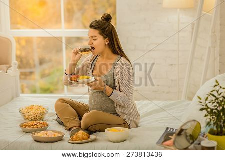 Woman Eating A Lot Of Sweets While Pregnancy