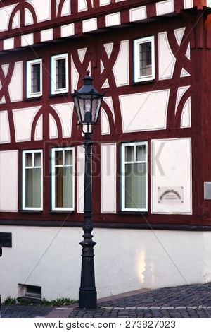 A Half-timbered House With A Striking Beam Construction On The Corner Of An Alley.