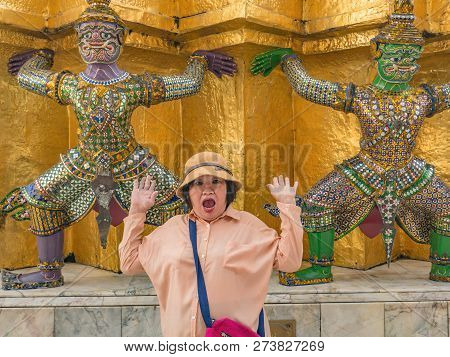 Portrait Of Senior Asian Women Make A Surprise With Giant Lift The Pagoda In Wat Phrakaew Temple Ban