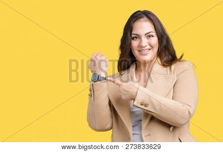 Beautiful plus size young woman wearing winter coat over isolated background In hurry pointing to watch time, impatience, upset and angry for deadline delay