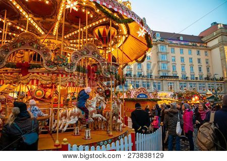 Dresden, Germany - 9.12.2018: Christmas Carousel At Night On Market Striezelmarkt In Dresden In Germ