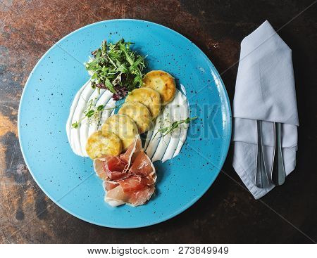 Potato Pancakes With Bacon On Blue Plate