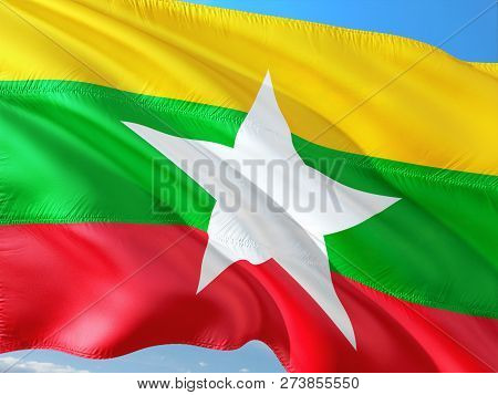 Flag Of Myanmar - Burma Waving In The Wind Against Deep Blue Sky. High Quality Fabric.