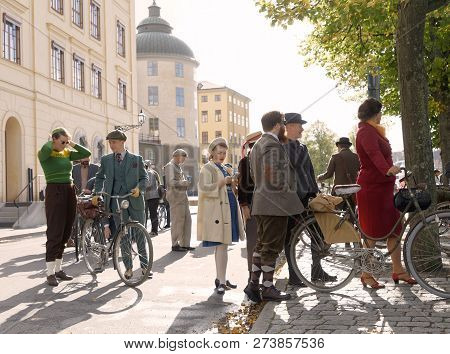 Stockholm - Sept 22, 2018: People Wearing Old Fashioned Tweed Clothes From The 1950s Leading Their R