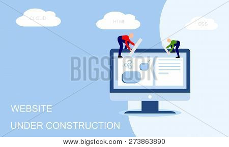 Website Under Construction. Two Of Young Professionals Working On A Web Page. Web Development.