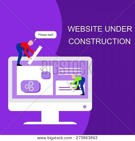 Website Under Construction. Two Of Young Professionals Working On A Web Page. Web Development.
