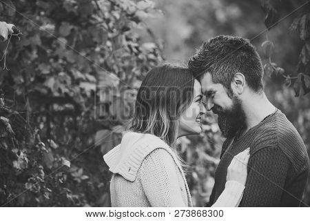 Couple With Smiling Faces Cuddle Each Other With Tenderness. Love And Romantic Concept. Couple In Lo