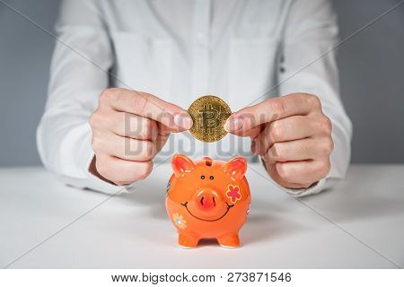 Golden Bitcoin In A Man Hand, Digitall Symbol Of A New Virtual Currency