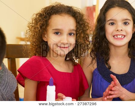 Young mixed race children doing handicrafts