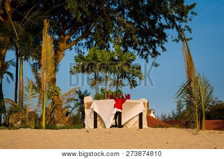 Sunny Pantai Cenang Beach With Exclusive Beach Restaurant Table On Tropical Langkawi Island In Malay