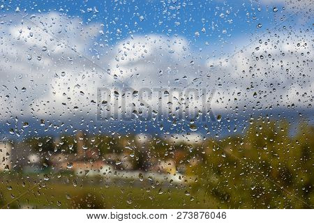 Water Drops On Window Glass In A Bright Colorful Sunny Day, Background, Abstract
