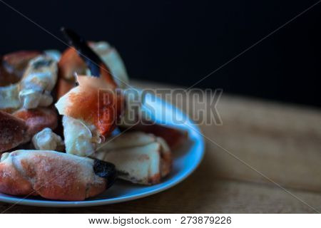 Crab Claws From Atlantic Coast On A Plate In The Black Background
