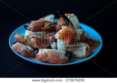 Crab Claws From Atlantic Coast On A Plate In The Black Background