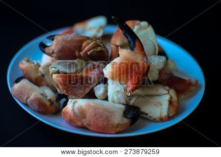 Crab Claws From Atlantic Coast On A Plate In The Black Background