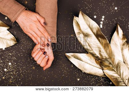 Holiday Beautiful Manicure With Golden Decorations, Christmas Concept.