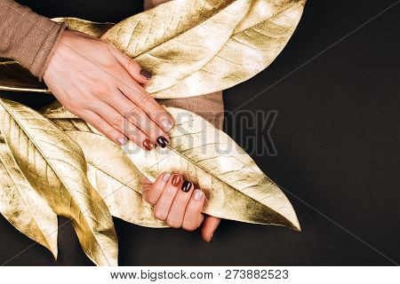 Holiday Beautiful Manicure With Golden Decorations. Dark Philosophy.