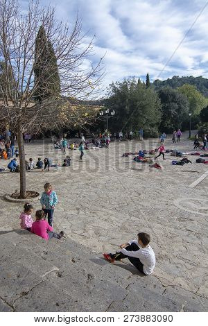 School Children Playing In The Yard By The Monastery