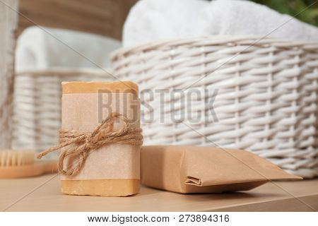 Soap Bar Near Laundry Basket On Table. Space For Text