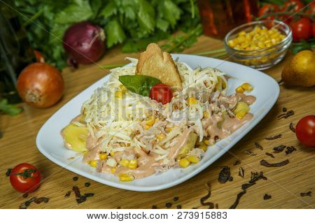 Portion Of Salad With Ham, Meat, Mushrooms, Vegetables And Mayonnaise