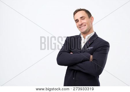 Heerful Guy Laughing And Looking At Camera With A Big Grin.