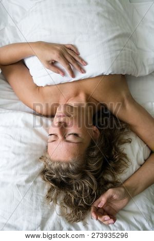 Beautiful Mature Blonde Sleeps In Bed. Rest And Sleep.