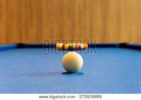 Billards Pool Game. White Ball On Spot With Set Colours Ball In Background.