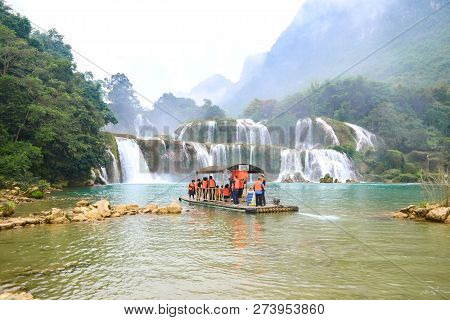 Cao Bang, Vietnam - Nov 30, 2018 : Tourist Visiting Ban Gioc Waterfall Or Detian Falls By Bamboo Boa