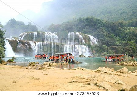 Cao Bang, Vietnam - Nov 30, 2018 : Tourist Visiting Ban Gioc Waterfall Or Detian Falls By Bamboo Boa