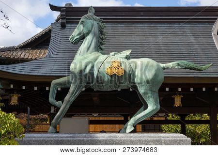 Fukuoka, Japan-October 19, 2018: Brass statue of sacred horse at the Kushida ninja shrine grounds