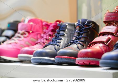 Row of the child shoes in a shop