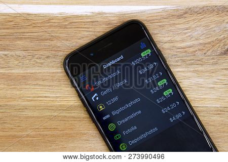 Amsterdam, The Netherlands - December 14, 2018: Black Smartphone Displaying Microstockr Application.