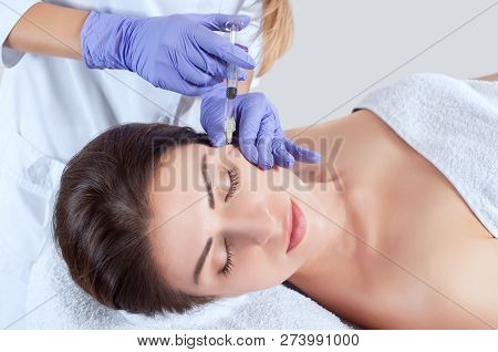The Doctor Cosmetologist Makes The Rejuvenating Facial Injections Procedure For Tightening And Smoot
