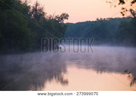 Mist Over A Quiet Winding River Flowing Between Wooded Banks. Morning On The River Oril. Ukraine
