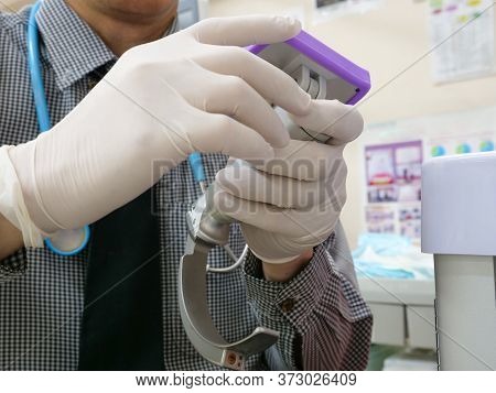 A Doctor Preparing A Video Laryngoscope For Endotracheal Intubation At Emergency Room, An Important 