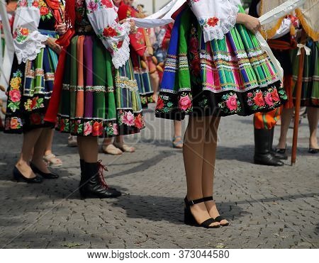 Beautiful Polish Girls In Traditional Folk Dresses Costumes From Lowicz Region While Join Corpus Chr