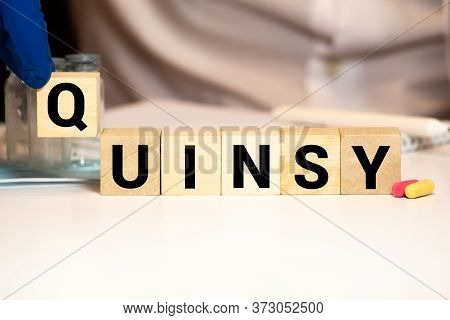 Quinsy Word On Wooden Cubes. Quinsy Concept. Medical Concept