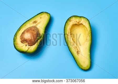 Sliced Avocado On A Blue Background.