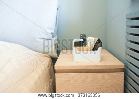 Organizer Box For Storing Personal Belongings, Stands On The Bedside Table Near The Bed. Inside The 