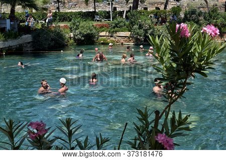 Pammukale, Turkey - July, 19, 2015: People In Antique Cleopatra\'s Pool With Thermal Water In Ancien